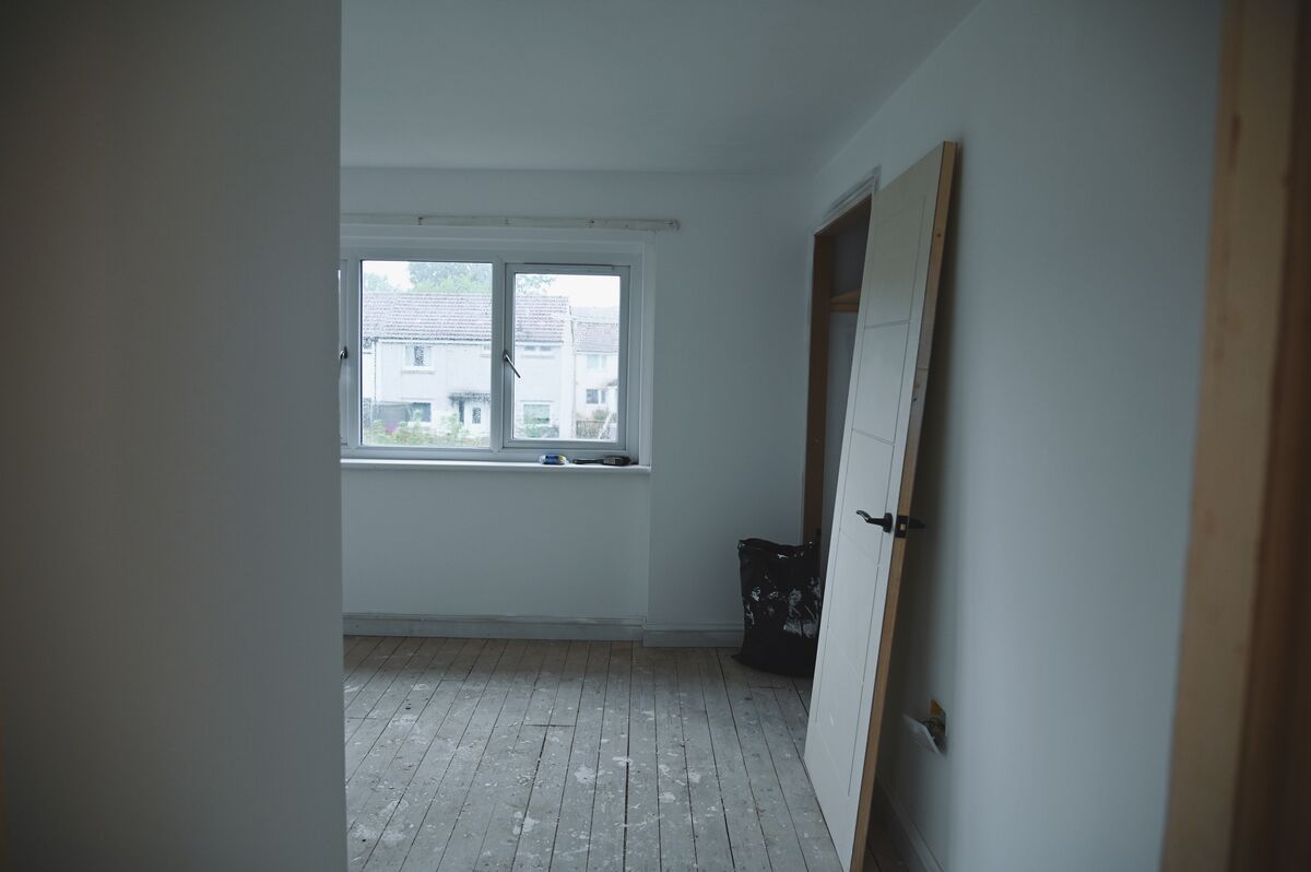 Room stripped back to bare floorboards during a full renovation in Glenrothes