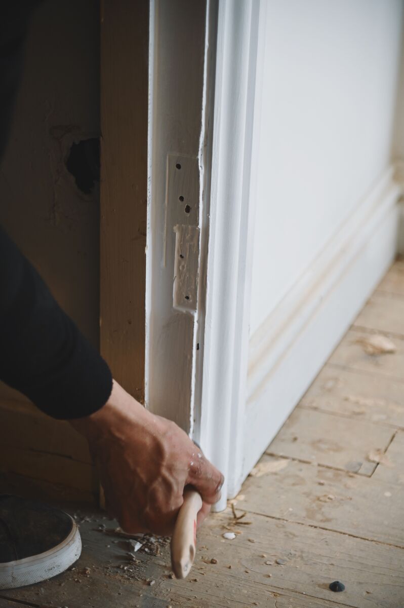 Fitting door architrave during a Glenrothes renovation