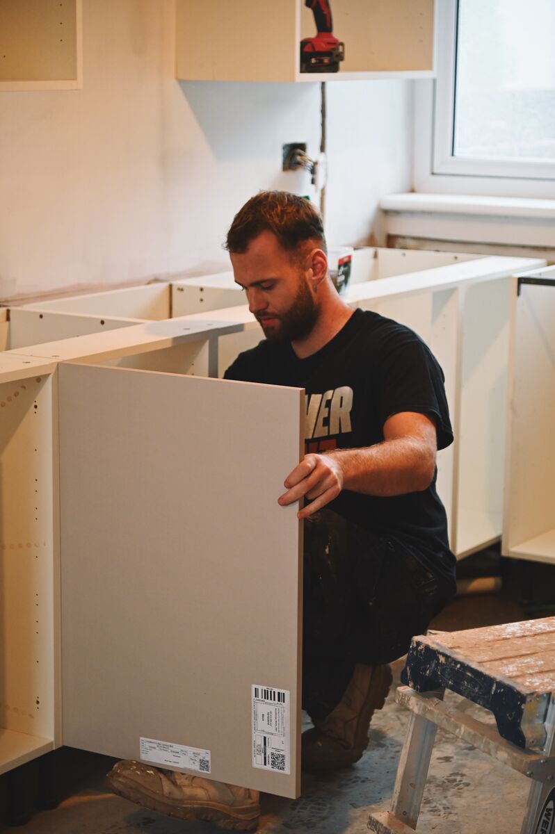 Fitting kitchen base units during a Glenrothes renovation